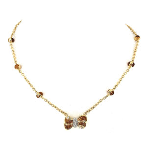 Collana in oro giallo e bianco 18kt g. 11,60 con 14 citrini cabocon (nel fiocco sfaccettate sotto e ritagliate su misura) e 12 diamanti naturali taglio brillante Colore G. vs 0,25 cts. Lunghezza cm 40